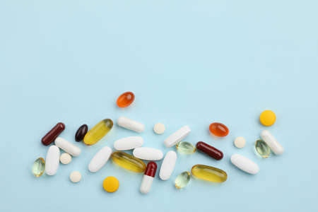 creative concept of medical pills on a blue backgroundの写真素材