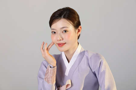 spring beauty concept, beautiful korean woman wearing hanbokの写真素材