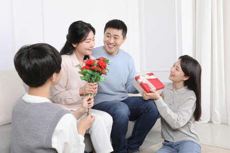 Asian Korean Family_Photo with carnations and giftsの写真素材