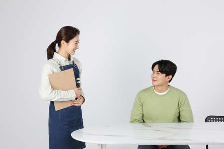 Asian Korean young man and woman startup concept_customer and boss ordering