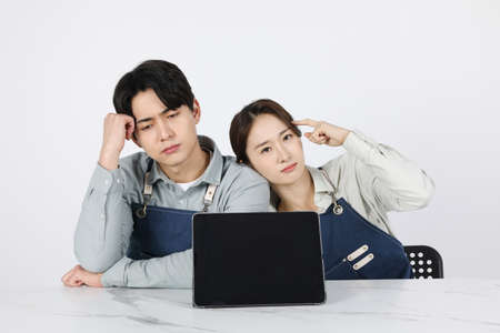 Asian Korean young man and woman startup concept_Worriedの写真素材