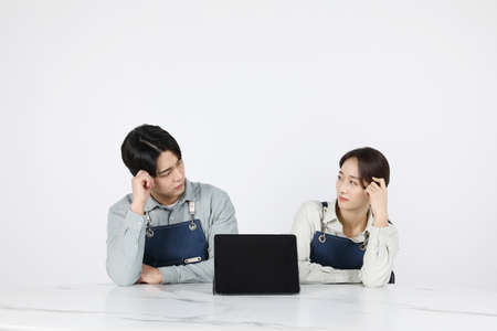 Asian Korean young man and woman startup concept_Contemplatingの写真素材