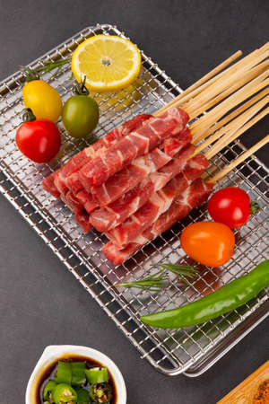 a picture of a raw skewer on the grill