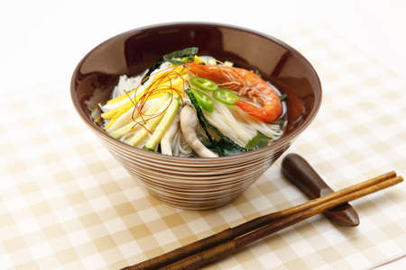 Warm and tasty food seafood rice noodles in a bowlの写真素材