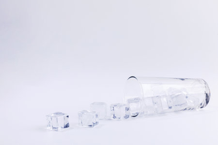 creative summer photo of ice and water cup, white background