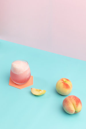 summer background with peach ade drink with peaches fruitの写真素材