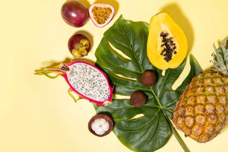 tropical fruit background for summer_pineapple, dragon fruit, mangosteen and bananaの写真素材
