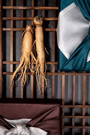 oriental, medicinal root plant, fresh ginseng wrapped in silk cloth for gift