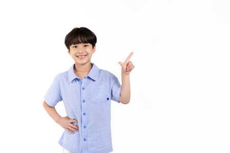 Korean young boy wearing summer blue half sleeve shirt in white background studio_gesturing sideways