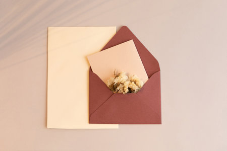 autumn aesthetics mood background with paper frame, envelope, dry flower
