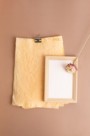 autumn aesthetics mood background with paper frame, dry flower