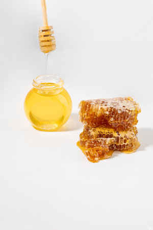 honeycomb, bottled honey, honey dipper stick