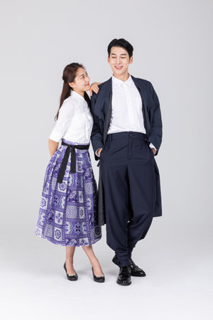 Korean young couple, man and woman wearing modern Hanbok_smilingの写真素材
