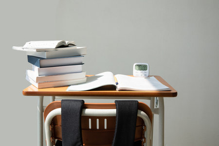studying at home, study desk setup_stack of workbooks