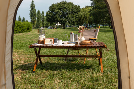 camping mood aesthetics_camping gear seen in the tentの写真素材