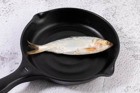 gizzard shad fish on the frying fanの写真素材