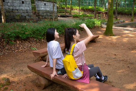 korean young women hiking and plogging_restingの写真素材