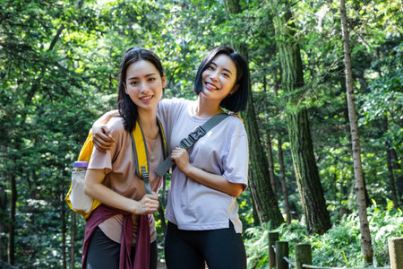 korean young women hiking and plogging_trekking mountainの写真素材