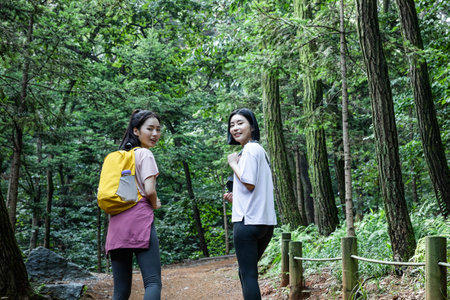 korean young women hiking and plogging_trekking mountainの写真素材