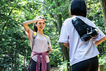 korean young women hiking and plogging_trekking mountainの写真素材