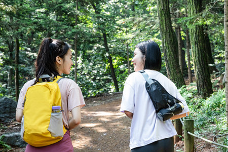 korean young women hiking and plogging_trekking mountainの写真素材