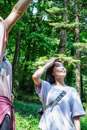 korean young women hiking and plogging_trekking mountainの写真素材