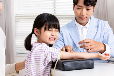Korean Asian child in doctor clinic hospitalの写真素材