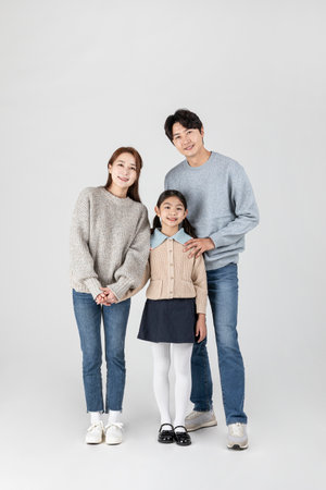 happy Asian Korean family, isolated in white backgroundの写真素材