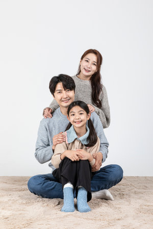 happy Asian Korean family, isolated in white backgroundの写真素材