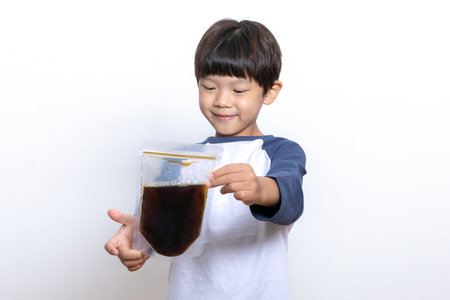 Asian Korean child holding oriental medicineの写真素材