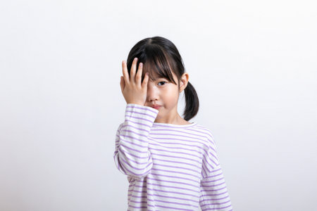 Asian Korean child feeling pain eyesの写真素材