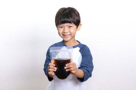 Asian Korean child holding oriental medicineの写真素材