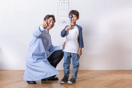 korean asian child in ophthalmic clinic, eyesight testの写真素材