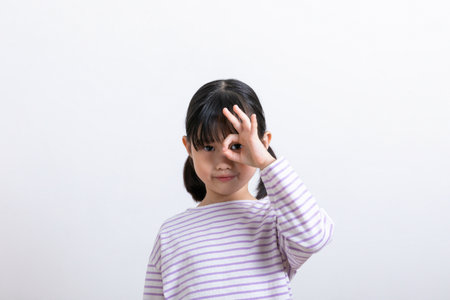 Asian Korean child with okay hand motionの写真素材