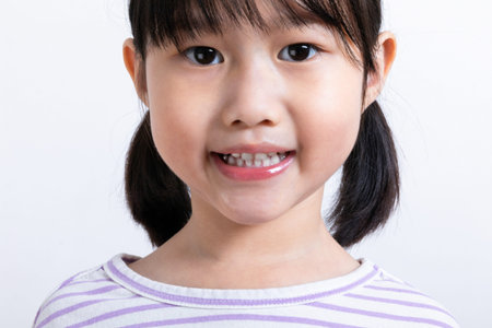 Asian Korean child showing teeth