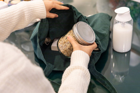 eco friendly habits hand gesture_put the ingredients in the eco bag