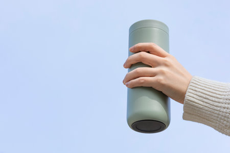 eco friendly habits hand gesture_holding a tumblerの写真素材