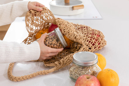 eco friendly habits hand gesture_taking out the ingredients from the shopping cart