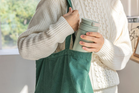 eco friendly habits hand gesture_tumbler and eco bagの写真素材