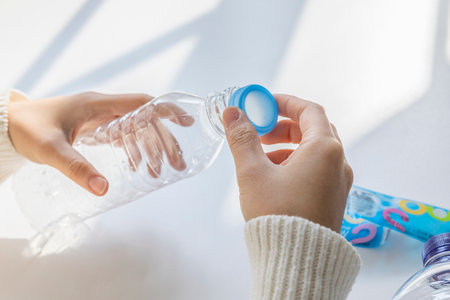 eco friendly habits hand gesture_plastic lid classificationの写真素材