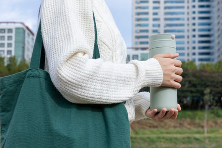 eco friendly habits hand gesture_holding a tumblerの写真素材