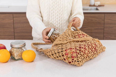 eco friendly habits hand gesture_taking out the ingredients from the shopping cart