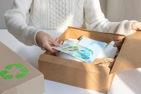 eco friendly habits hand gesture_eco friendly delivery packagingの写真素材