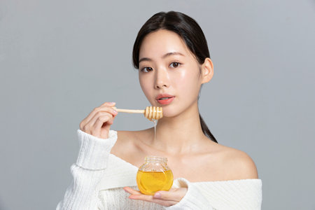 beautiful young Korean Asian woman portrait studio photo in winter skin beauty and cosmetics concept__lipcareの写真素材