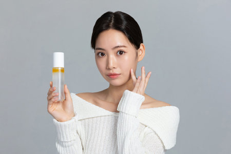 beautiful young Korean Asian woman portrait studio photo in winter skin beauty and cosmetics concept__holding a mistの写真素材