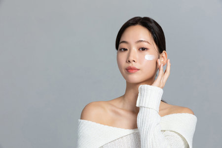 beautiful young Korean Asian woman portrait studio photo in winter skin beauty and cosmetics concept__use nourishing creamの写真素材