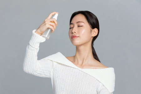 beautiful young Korean Asian woman portrait studio photo in winter skin beauty and cosmetics concept__use eye creamの写真素材