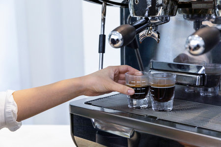 barista brewing, preparing coffee in cafeの写真素材