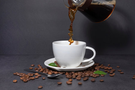 creative concept photo of coffee beans and coffee cupsの写真素材