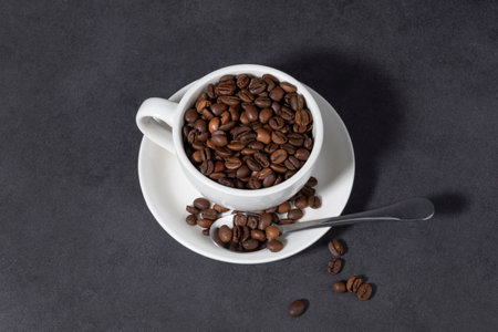 creative concept photo of coffee beans and coffee cupsの写真素材